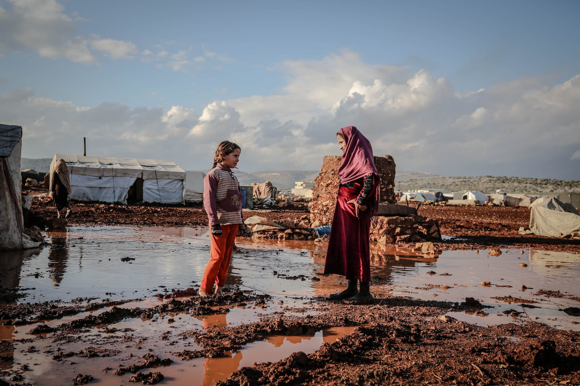 woman in hijab talking with girl